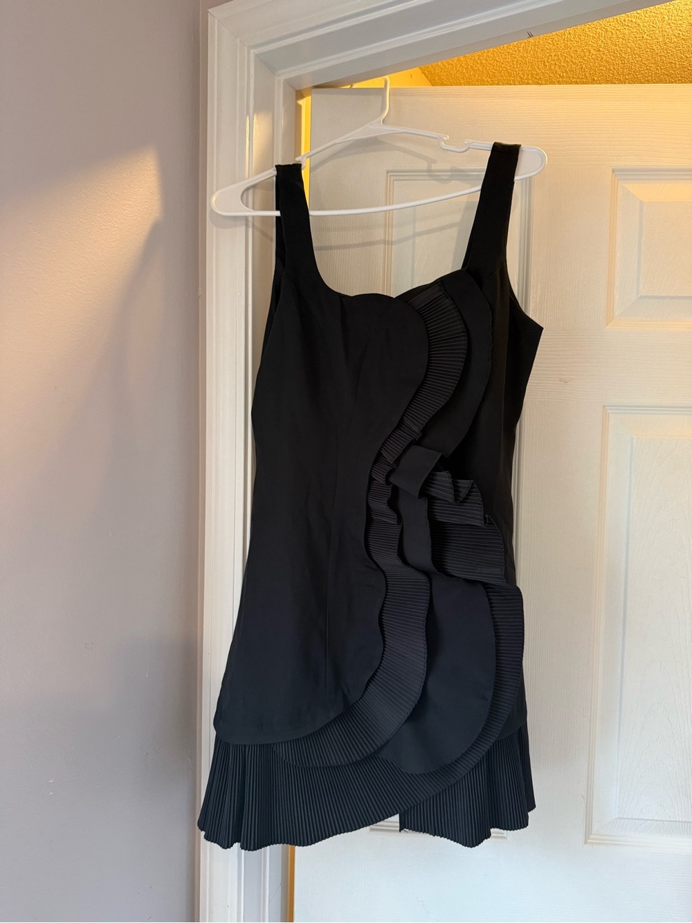 Black Ruffle-Detail Mini Dress with Pleated Hem
